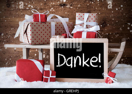 Sleigh con doni, neve fiocchi di neve, Danke significa Grazie Foto Stock