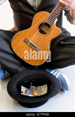 Ukulele e Busker in Studio Foto Stock