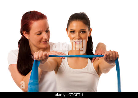 Fisioterapia - terapista braccio facendo esercizi strenghteninh con un paziente per recuperare la forza dopo la lesione Foto Stock