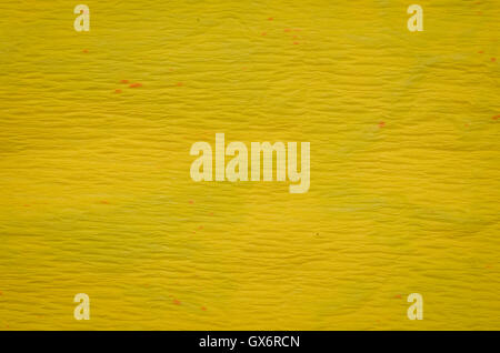 Colore giallo carta crespa texture di sfondo Foto Stock