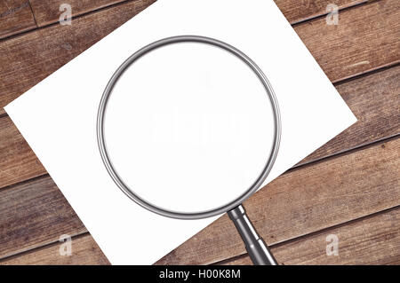 Lente di ingrandimento ed il foglio di carta con lo spazio per il tuo testo,3d rendering Foto Stock