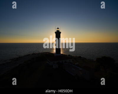 Faro al tramonto in Veli Rat in Croazia Foto Stock