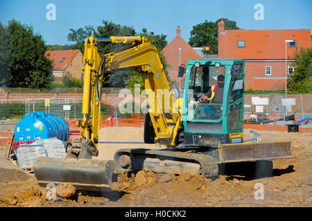 Un lavoro di scavo su un sito di costruzione Foto Stock