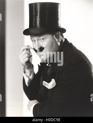 Uomo in top hat con baffi lucidi Foto Stock