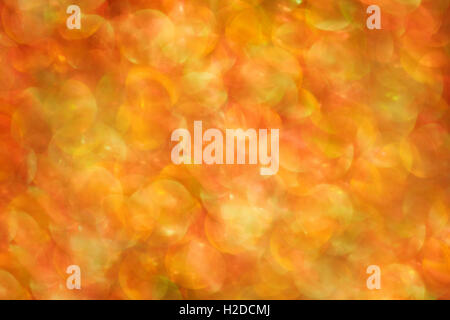 Abstract background sfocati con luci colorate. In rosso e colori dorati Foto Stock
