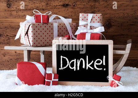 Sleigh con doni sulla neve, Danke significa Grazie Foto Stock