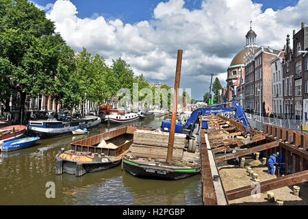 Costruzione di riparazione Dike Wall Street Canal sul Singel Amsterdam Paesi Bassi Foto Stock
