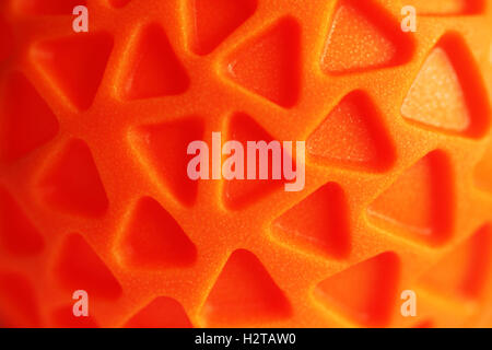 Gomma arancione texture con pattern triagle close up luminose Foto Stock