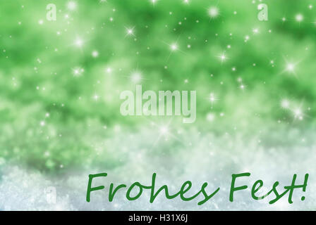 Verde sfondo spumanti, neve Frohes Fest significa Buon Natale Foto Stock