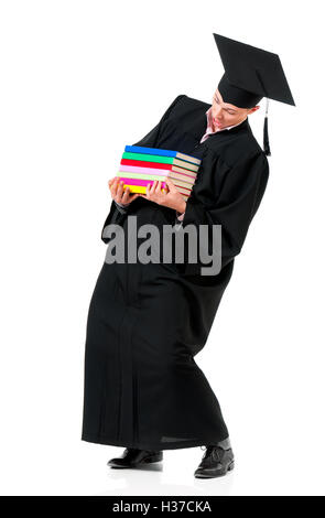 Uomo di graduazione portano pesanti libri Foto Stock