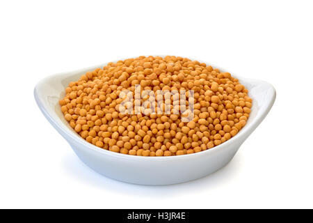 Grano intero senape in ciotola su bianco Foto Stock