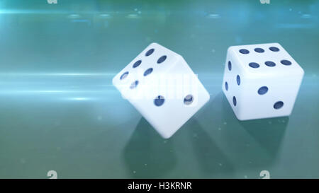 Laminazione a due dadi bianchi con uno sfondo verde closeup Foto Stock