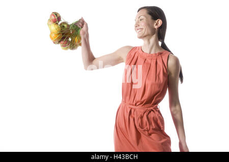 Donna, stringa di borsa, frutta, sorriso, felicemente, Foto Stock