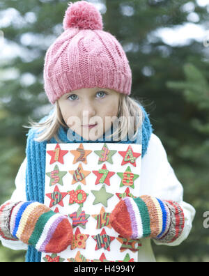 Ragazza, cappellino, foulard, guanti, calendario dell'Avvento, azienda, ritratto, Foto Stock