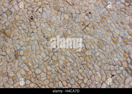 Lo sfondo o la tessitura di un cobblestone pavement Foto Stock