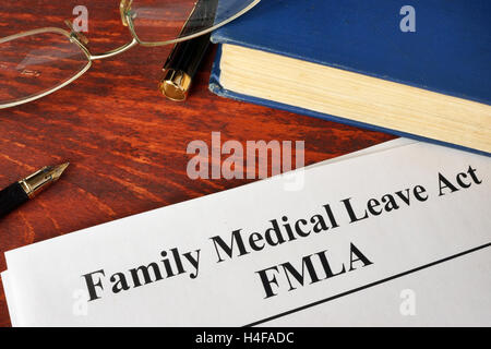 FMLA Family Medical Leave Act e un libro. Foto Stock