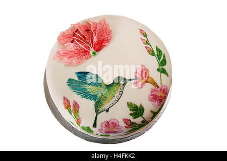 Torta rotonda con fondente e dipinto di colibrì e fiori Foto Stock