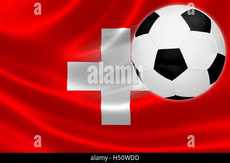 Bistecche a sfera attraverso la bandiera della Svizzera dove il calcio è una passione nazionale. Foto Stock