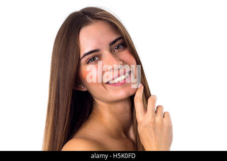 Donna in piedi lateralmente e a contatto con la faccia Foto Stock