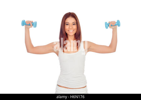 Felice ragazza in bianco di tonificazione dei muscoli del suo isolato Foto Stock