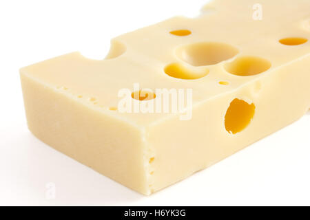 Blocco di tipo svizzero il formaggio su bianco Foto Stock