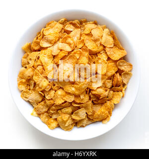 Ciotola di cornflake a secco isolato su bianco dal di sopra. Foto Stock