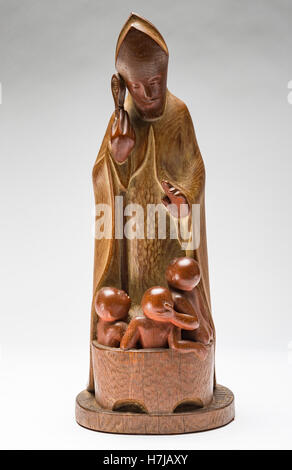 San Nicola con bambini, cerussa legno di quercia scultura di scultore francese Jean Henninger Foto Stock