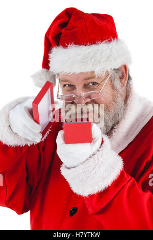 Santa Claus apertura di una confezione regalo Foto Stock