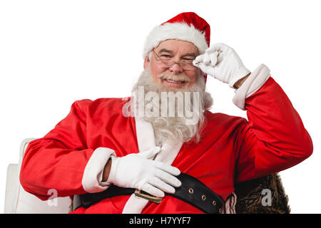 Sorridente santa claus seduti su una sedia Foto Stock