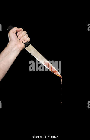 Mano con coltello insanguinato Foto Stock