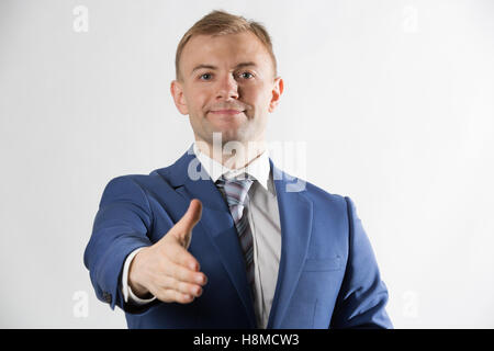 Uomo d'affari offrendo la sua mano Foto Stock