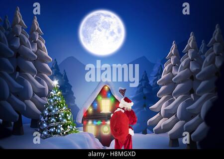 Babbo Natale in piedi al di fuori della casa Foto Stock