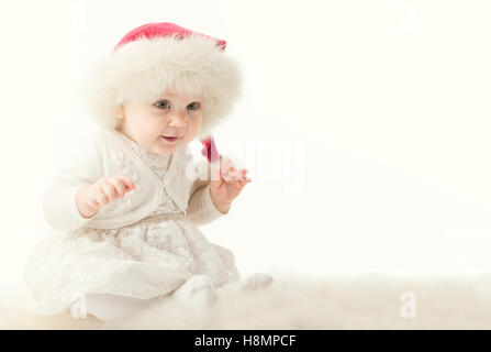 Baby babbo natale rosso con cappuccio di pelliccia Foto Stock