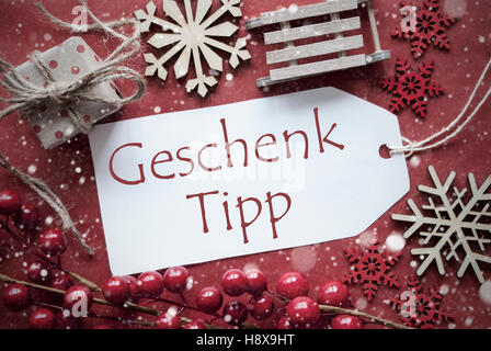 Nostalgico decorazione di Natale, etichetta con Geschenk Tipp significa Dono suggerimento Foto Stock