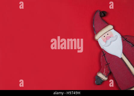 Scheda di Natale sul rosso con santa Foto Stock