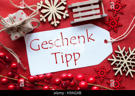 Etichetta con decorazione di Natale, Geschenk Tipp significa Dono suggerimento Foto Stock