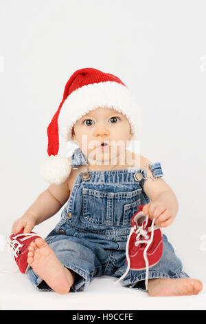 Baby Santa clausola ottenere pronto per Natale Foto Stock