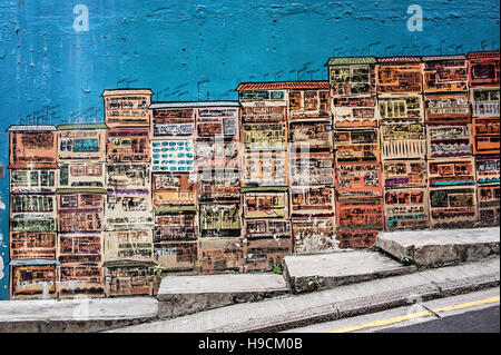 Parete dipinta accanto a G.O.D. (Beni di desiderio) negozio nel centro di Hong Kong Foto Stock