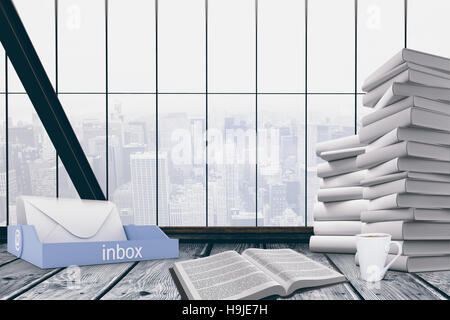 Immagine composita di una casella di posta a fianco di libri Foto Stock