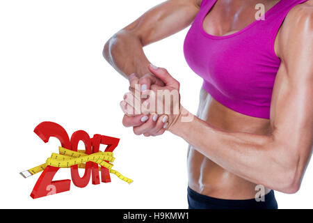 3D'immagine composita di bodybuilder femminile in posa con le mani insieme Foto Stock