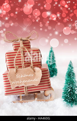 Natale verticale slitta, sfondo rosso, mezzi Wochenende Weekend Foto Stock