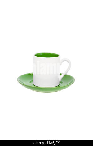 Small empty white coffee cup with green detail on a saucer Foto Stock