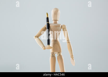 Statuetta di legno di supporto della penna Foto Stock