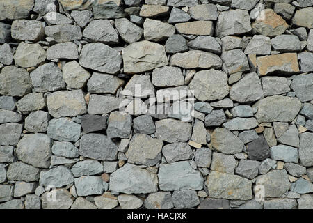 Muro di pietra naturale di sfondo - parete di macerie Foto Stock