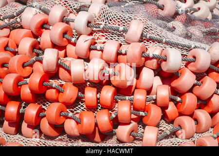 Fishermans net dettaglio sfondo in tono rosso. Posizione orizzontale Foto Stock