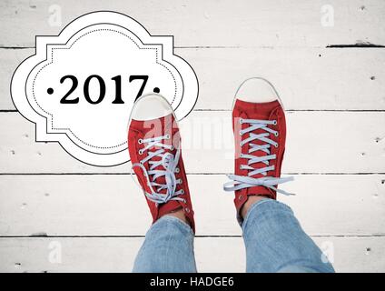 2017 Anno nuovo auguri con adolescente indossando sneakers rosso Foto Stock