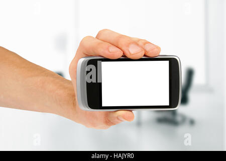 Mano azienda vuoto mobile smart phone in ufficio Foto Stock