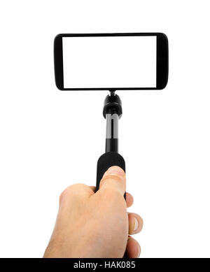 Tenendo selfie - tenere in mano monopiede con telefono mobile Foto Stock