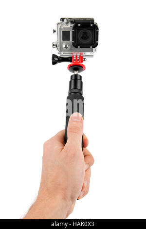Tenendo selfie - tenere in mano monopiede con telecamera di azione Foto Stock