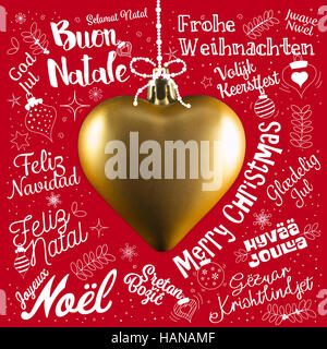 Buon Natale biglietto di auguri da tutto il mondo in diverse lingue con cuore d'oro, testo calligrafico e font di caratteri scritti a mano Foto Stock